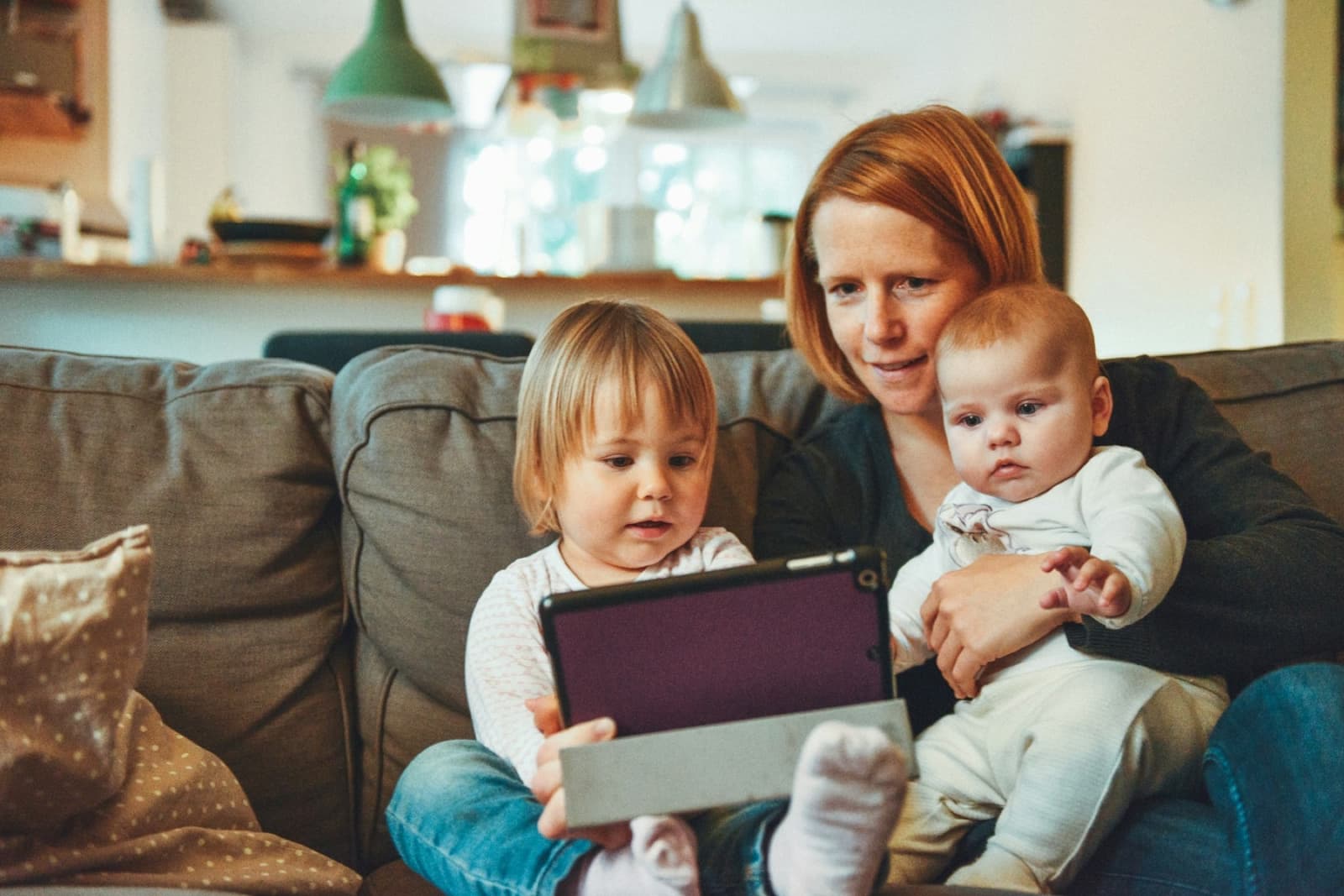 A mother at home with her two young children