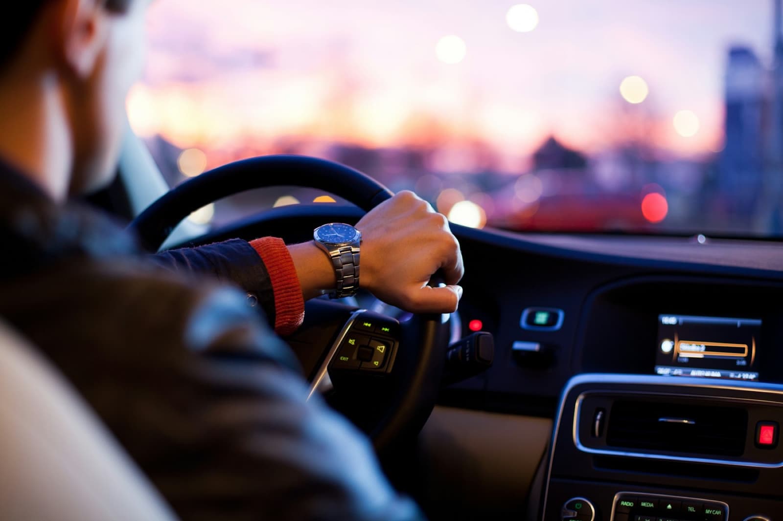 A driver at the wheel on a city road